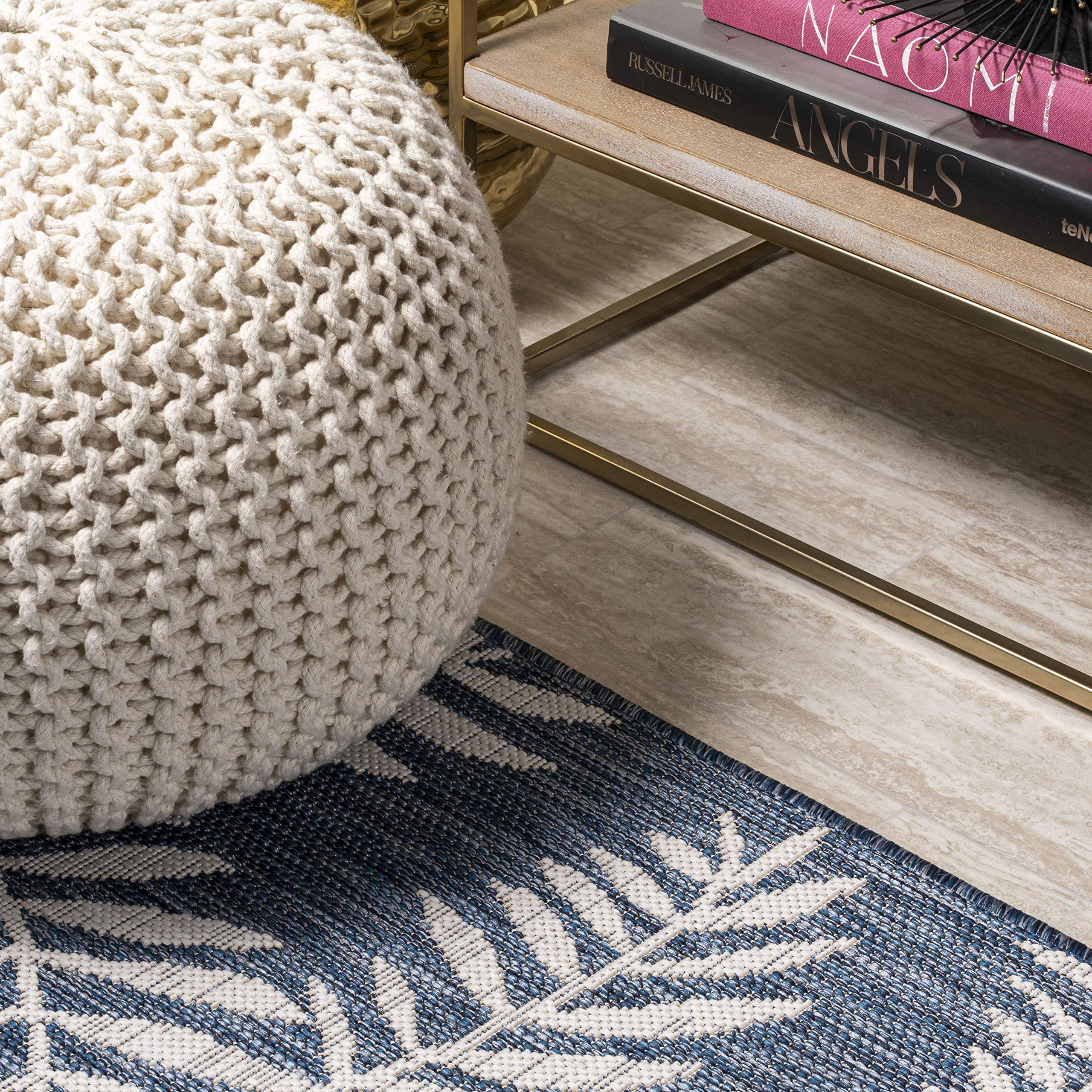 JONATHAN Y Palm Frond Round Area Rug next to furniture