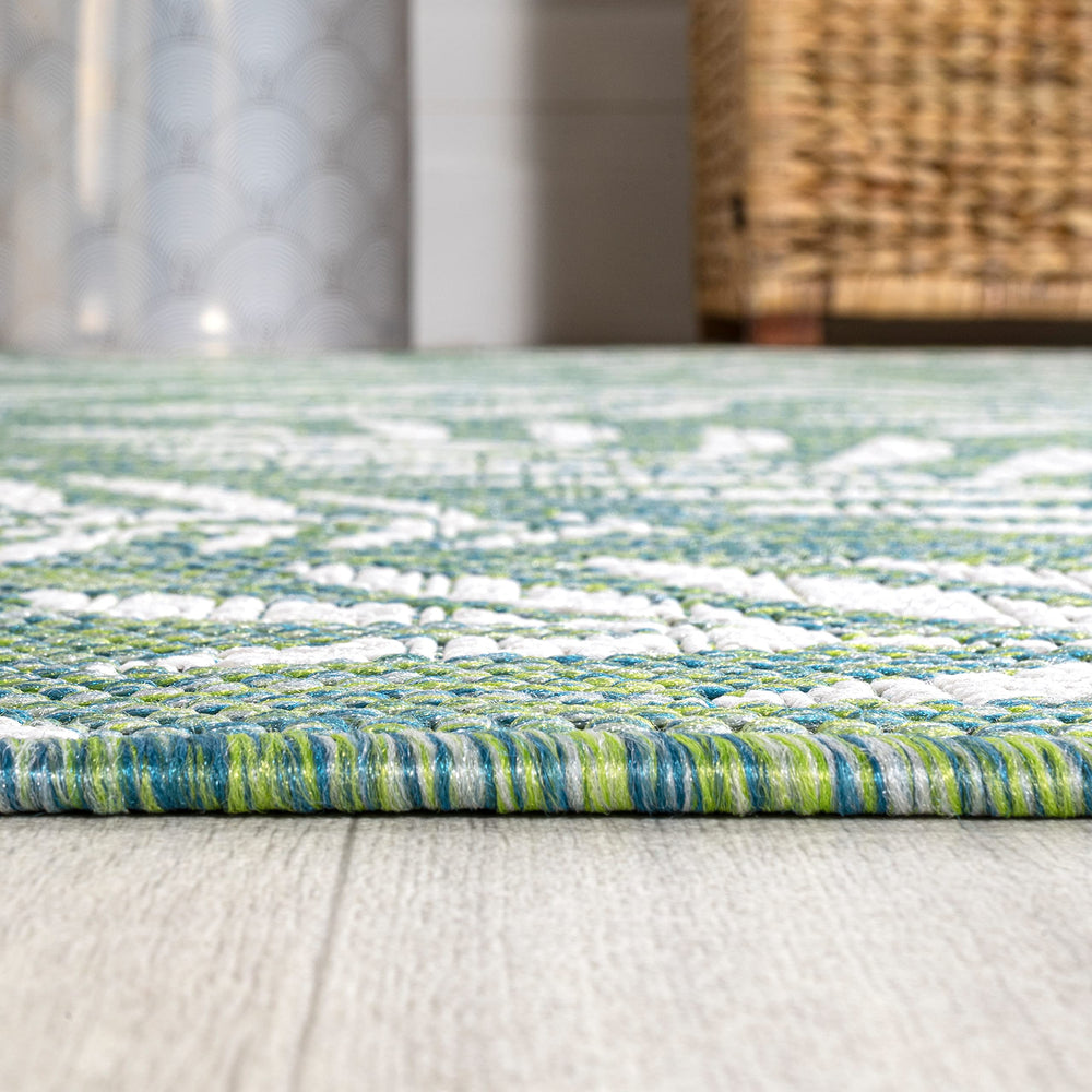 JONATHAN Y Palm Frond Rug in a hallway