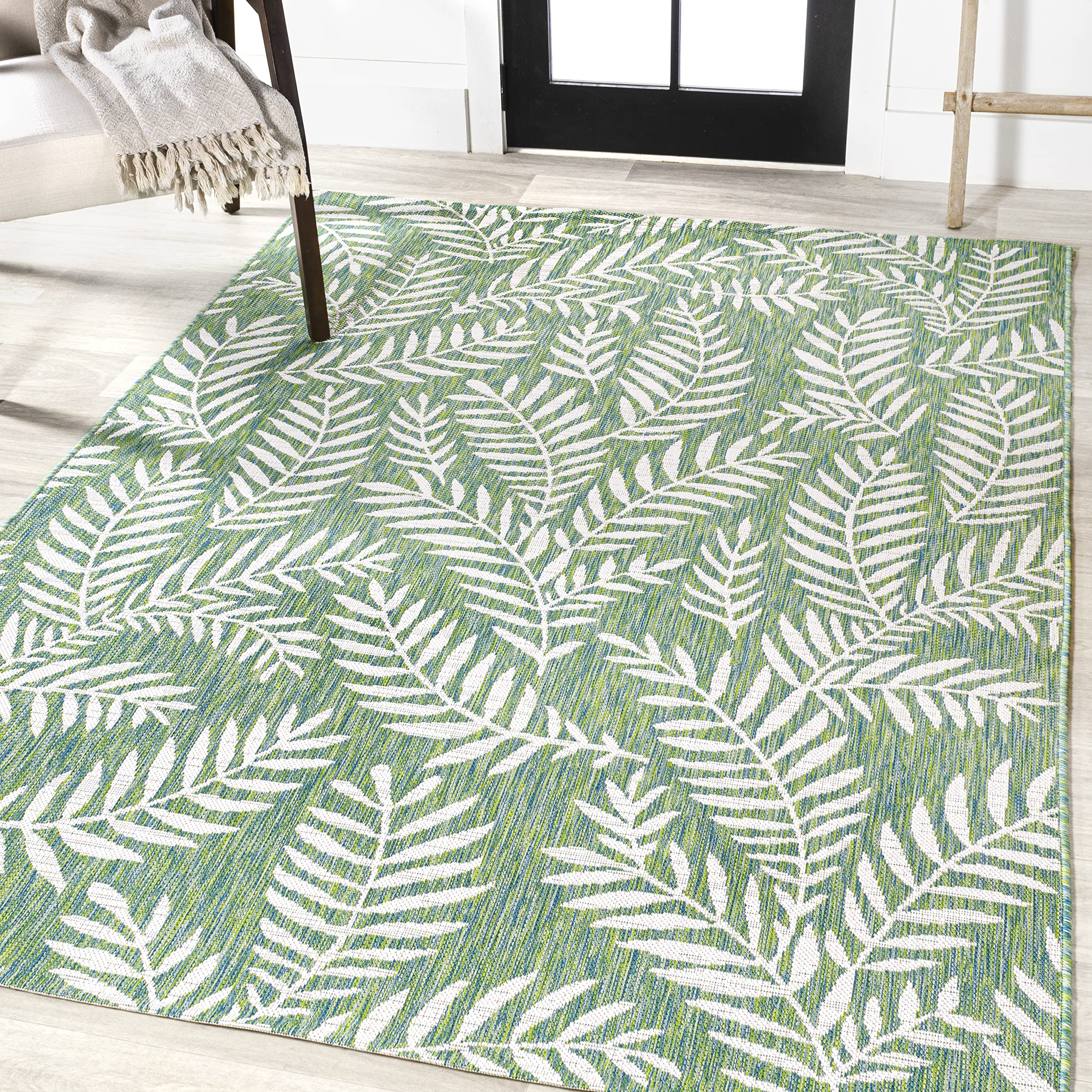 JONATHAN Y Palm Frond Rug on patio setting