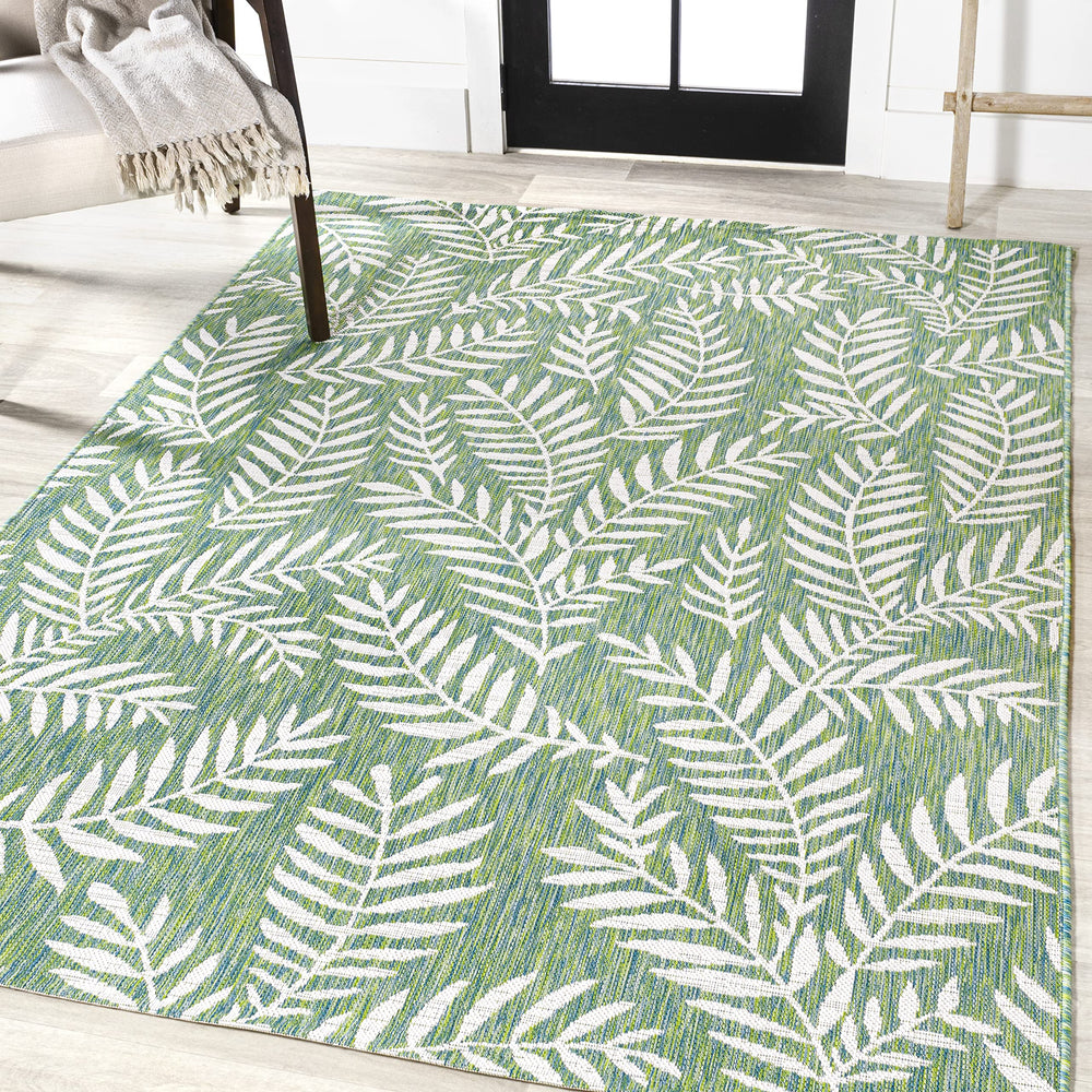JONATHAN Y Palm Frond Rug on patio setting