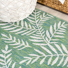 JONATHAN Y Palm Frond Runner Rug in outdoor setting on patio