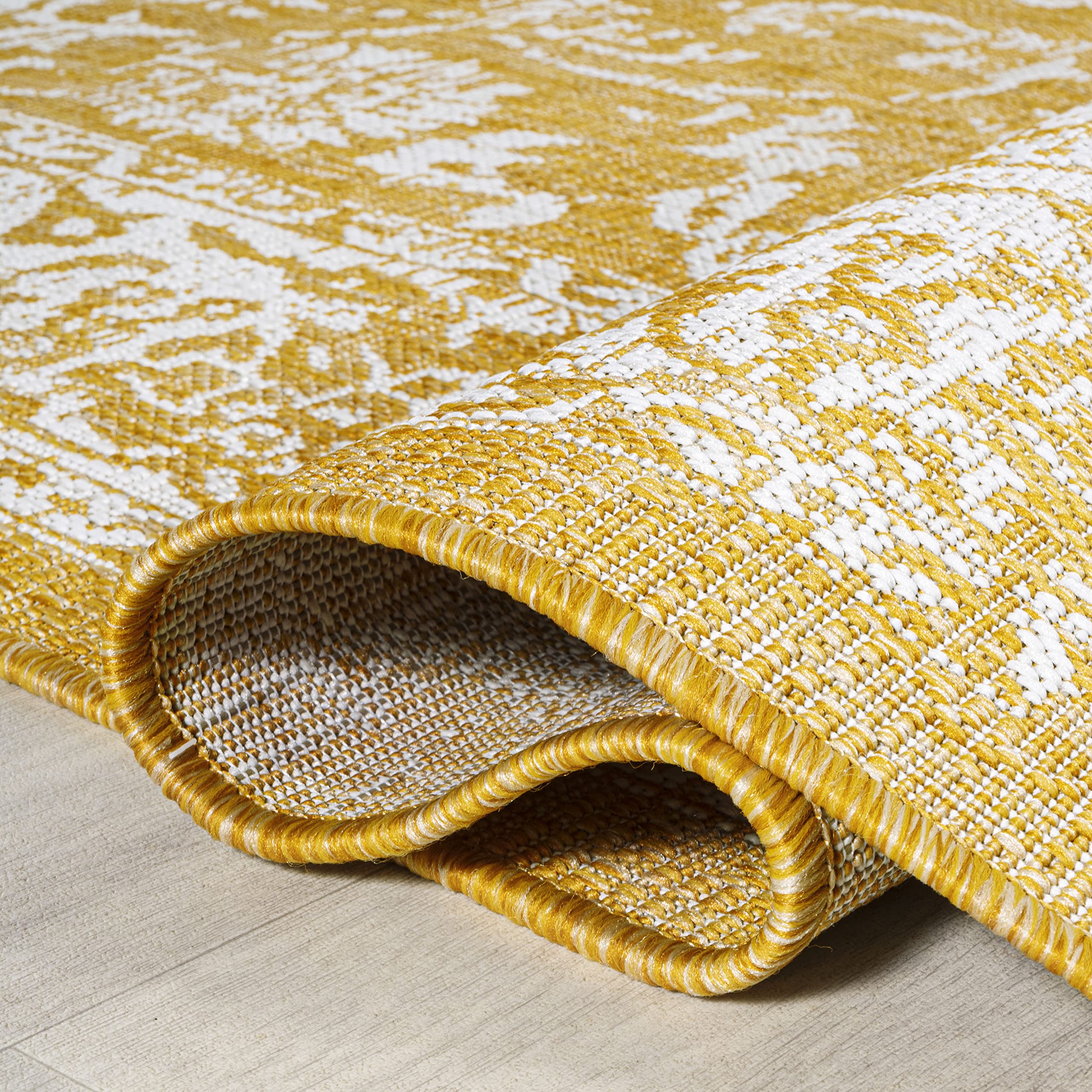 JONATHAN Y Weave Floral Area Rug 3'1"x5' in a garden setting