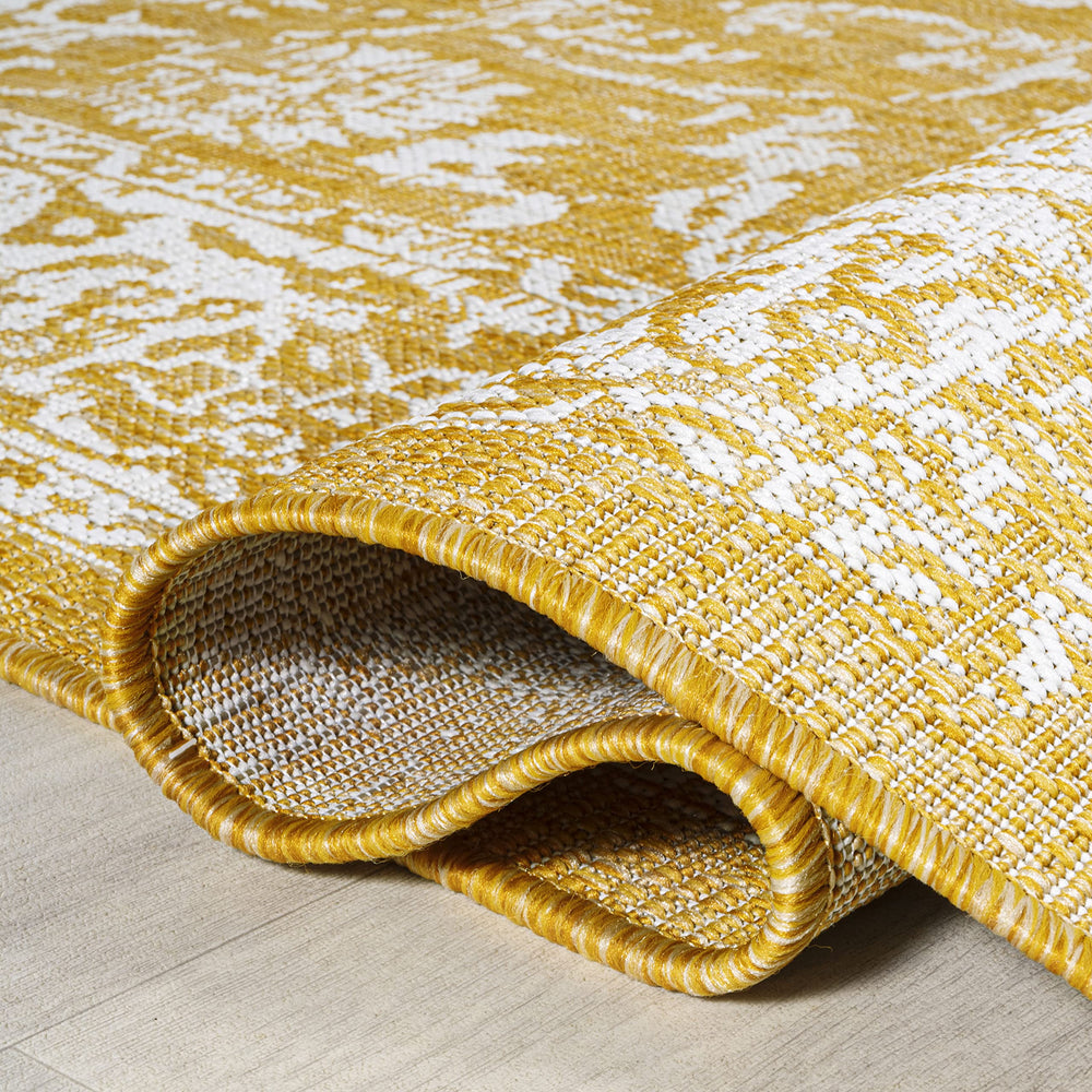 JONATHAN Y Weave Floral Area Rug 3'1"x5' in a garden setting