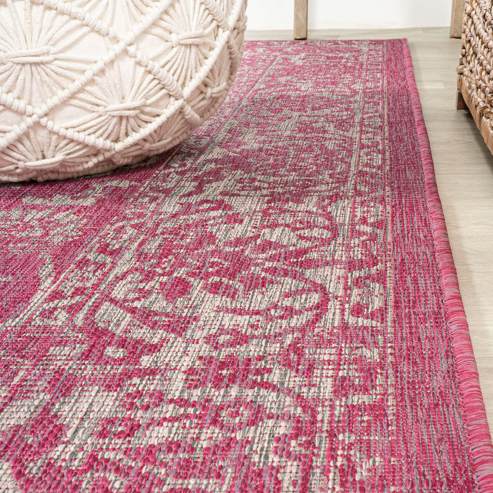 JONATHAN Y Weave Floral Area Rug displayed in a living room