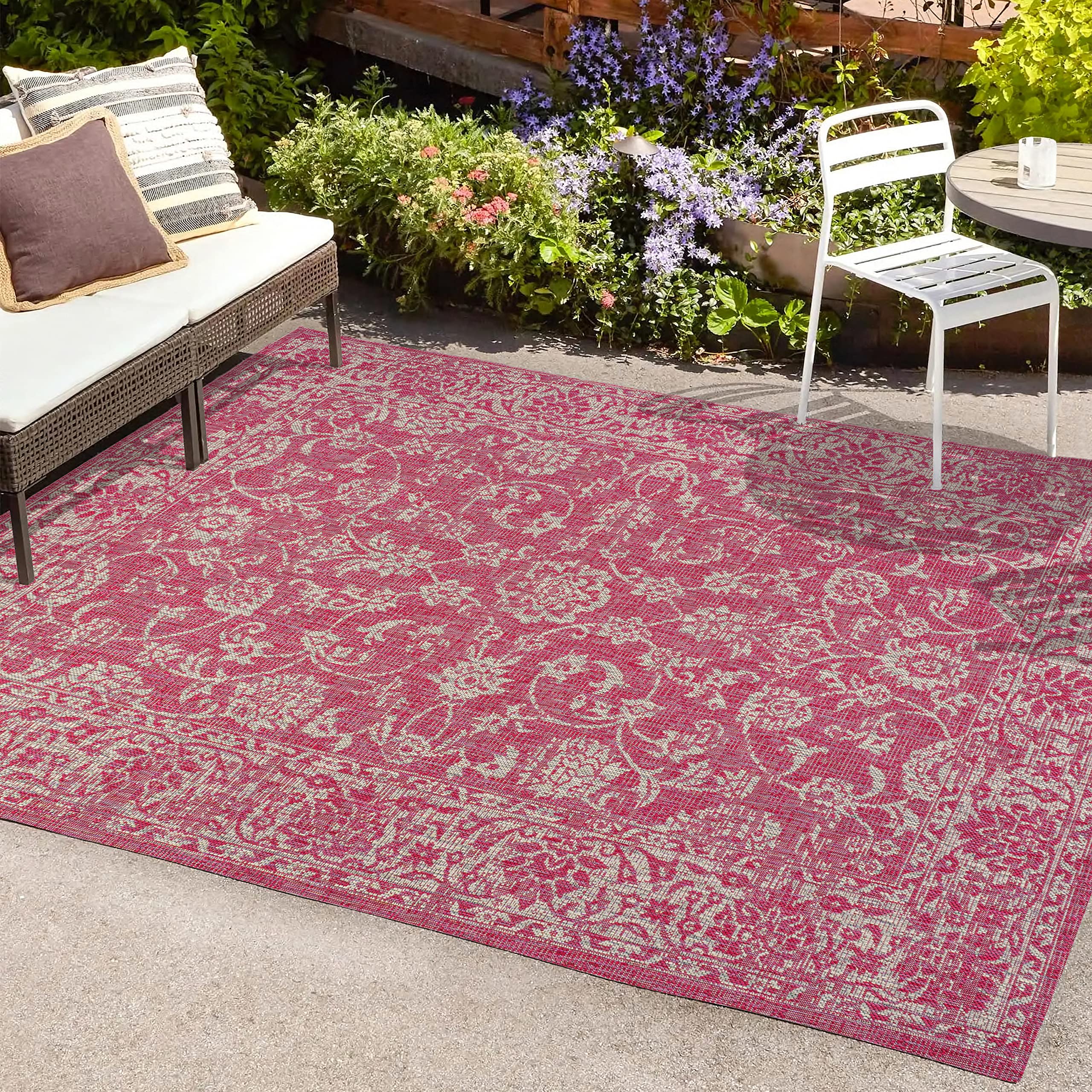 JONATHAN Y Weave Floral Area Rug in outdoor patio setting