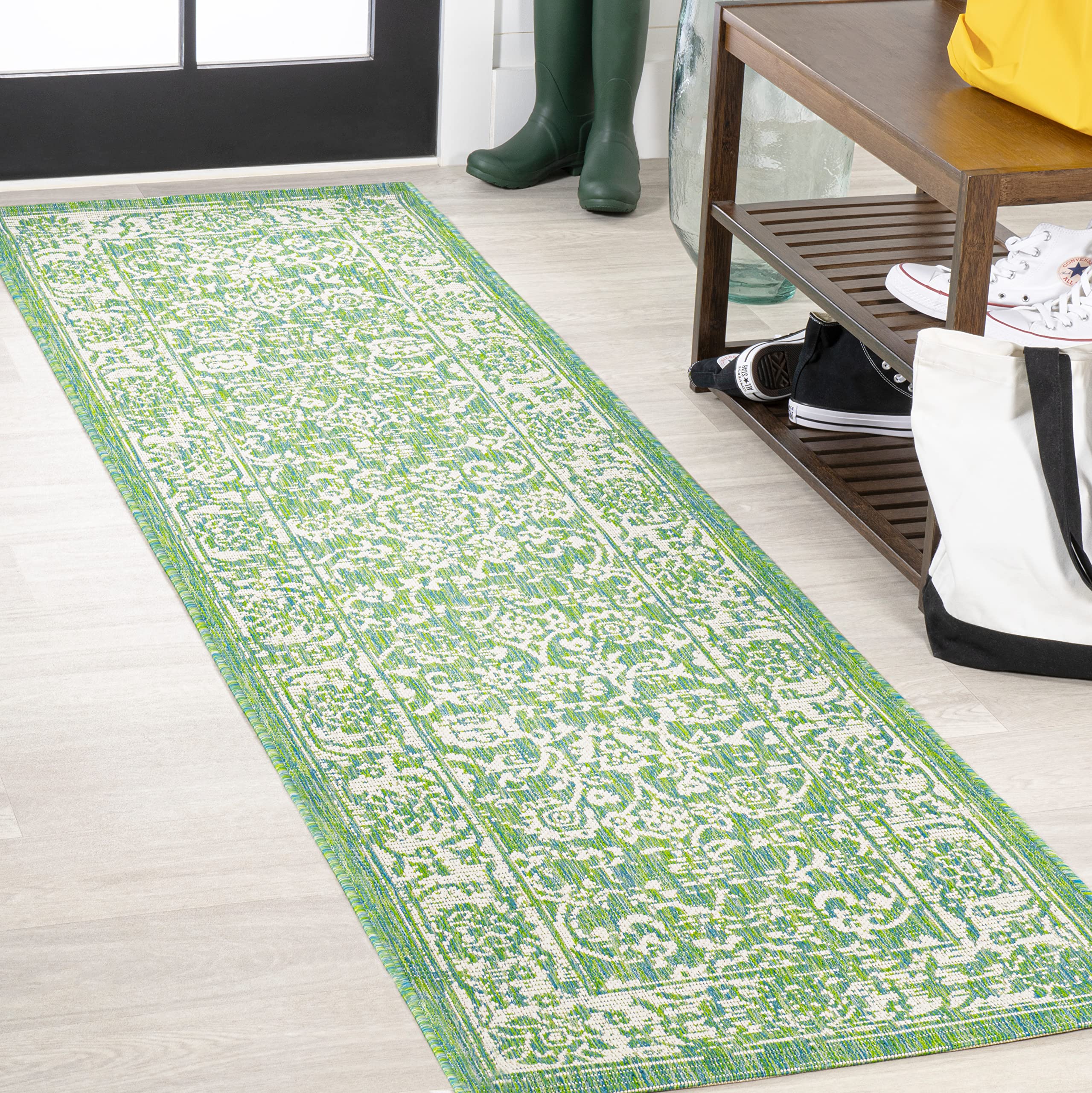 JONATHAN Y Weave Floral Indoor Outdoor Runner Rug displayed on a patio