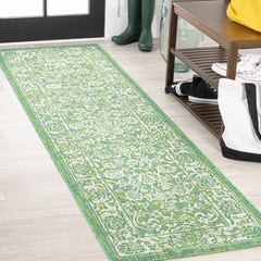 JONATHAN Y Weave Floral Indoor Outdoor Runner Rug displayed on a patio