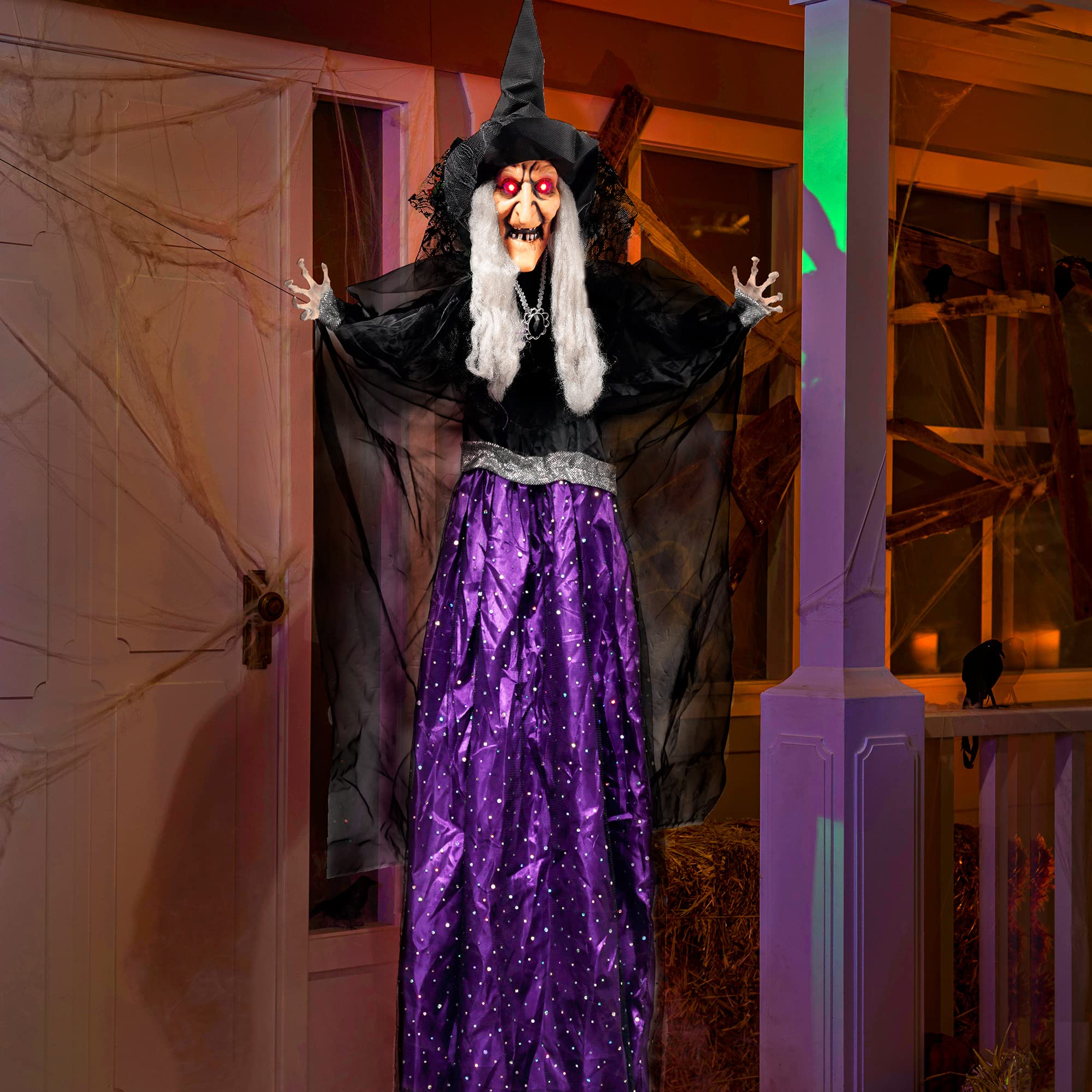 JOYIN animated witch hanging from a tree outside