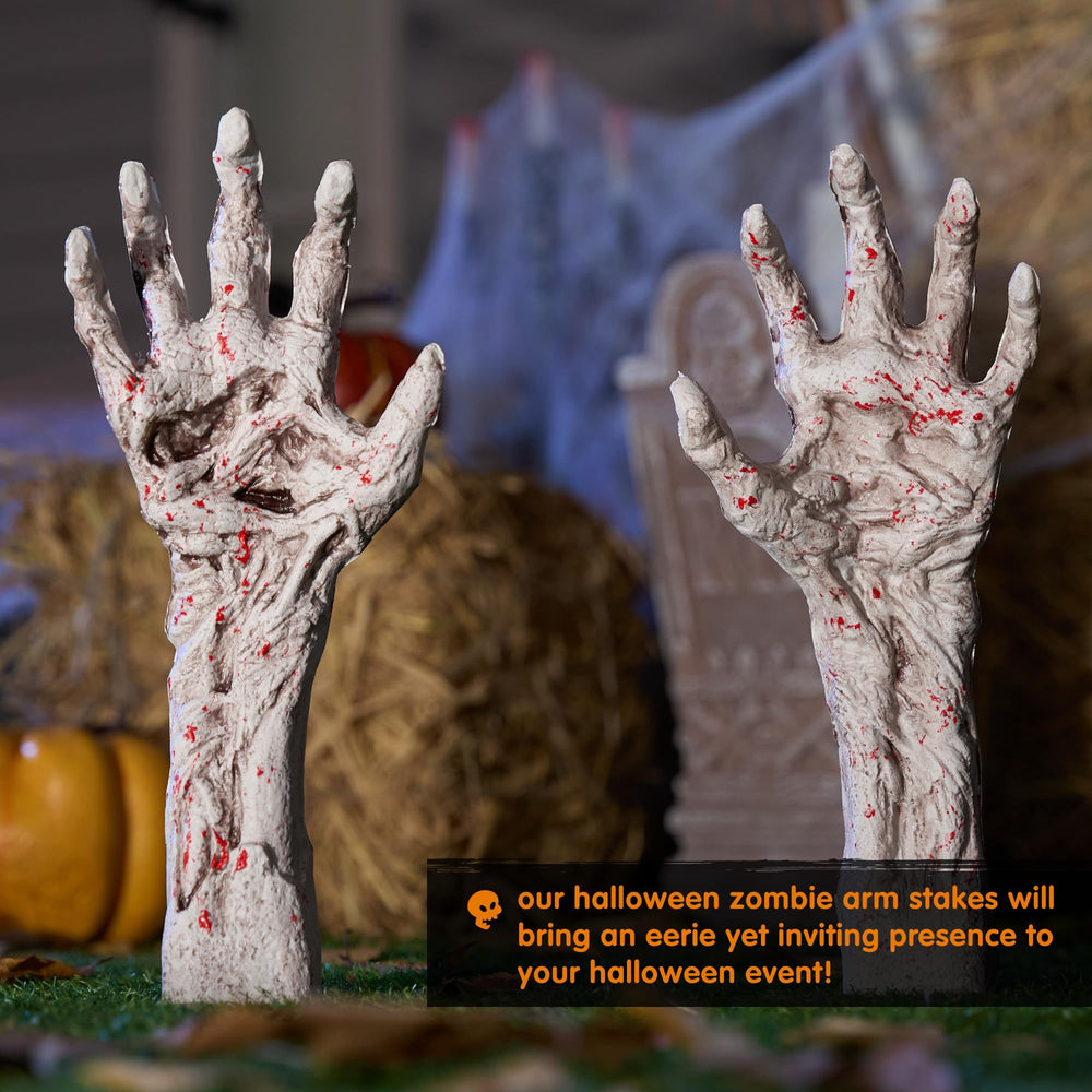 JOYIN Zombie Arm Stake next to a tombstone