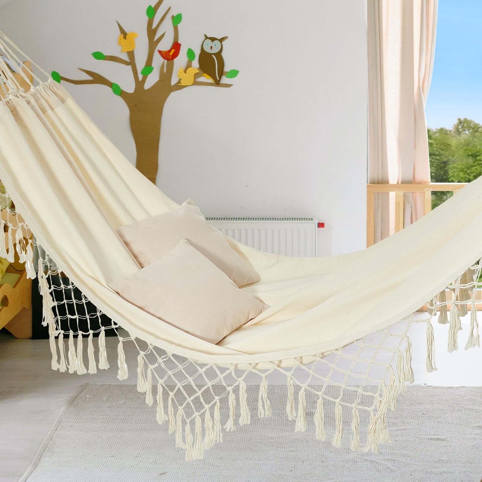 JoyView Boho Macrame Hammock hanging between trees