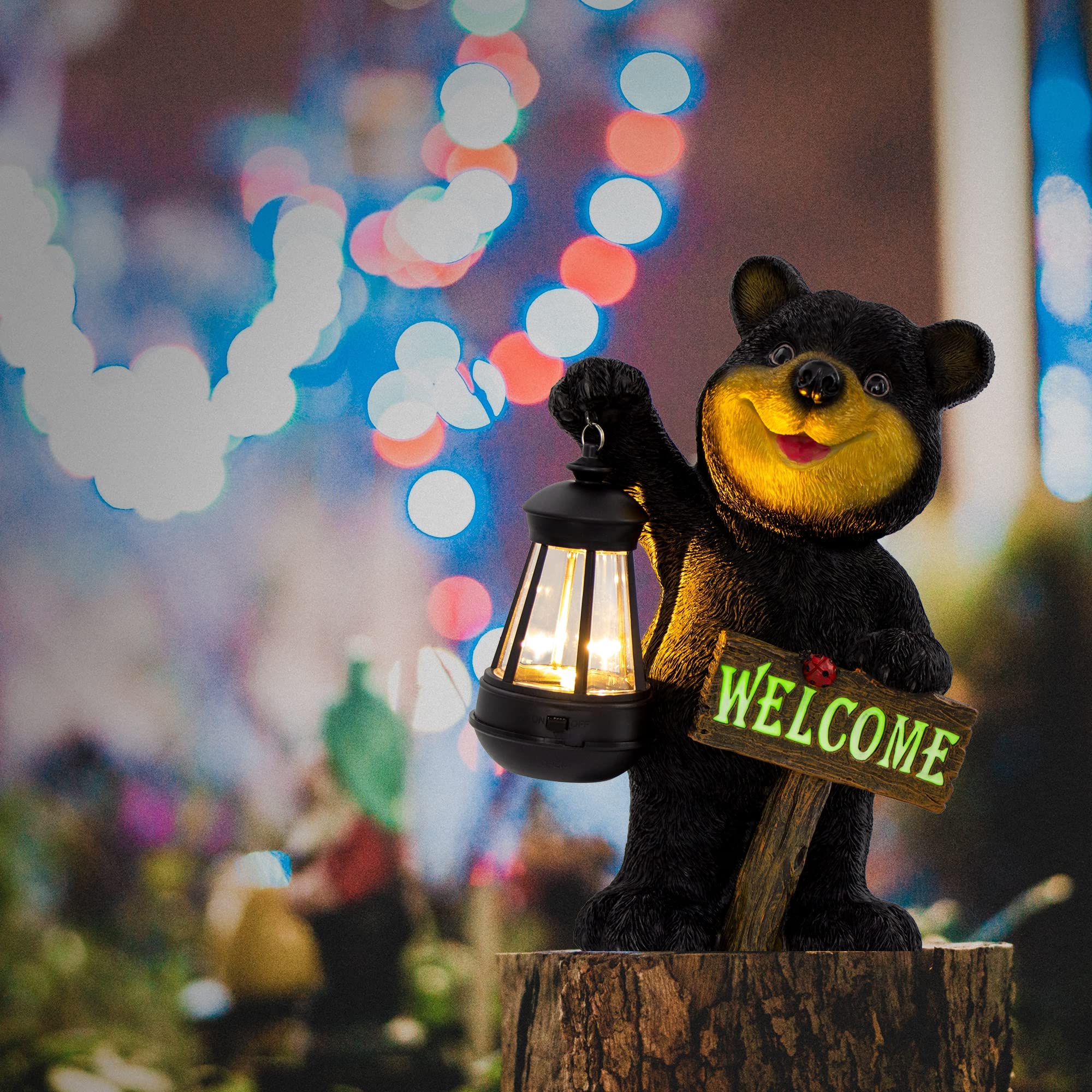 Juegoal Garden Bear Statue illuminated by solar light at night