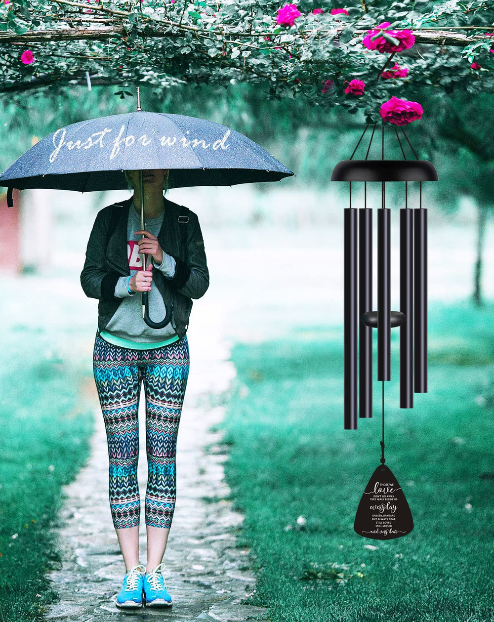 JUST FOR WIND Wind Chimes hanging in a garden setting