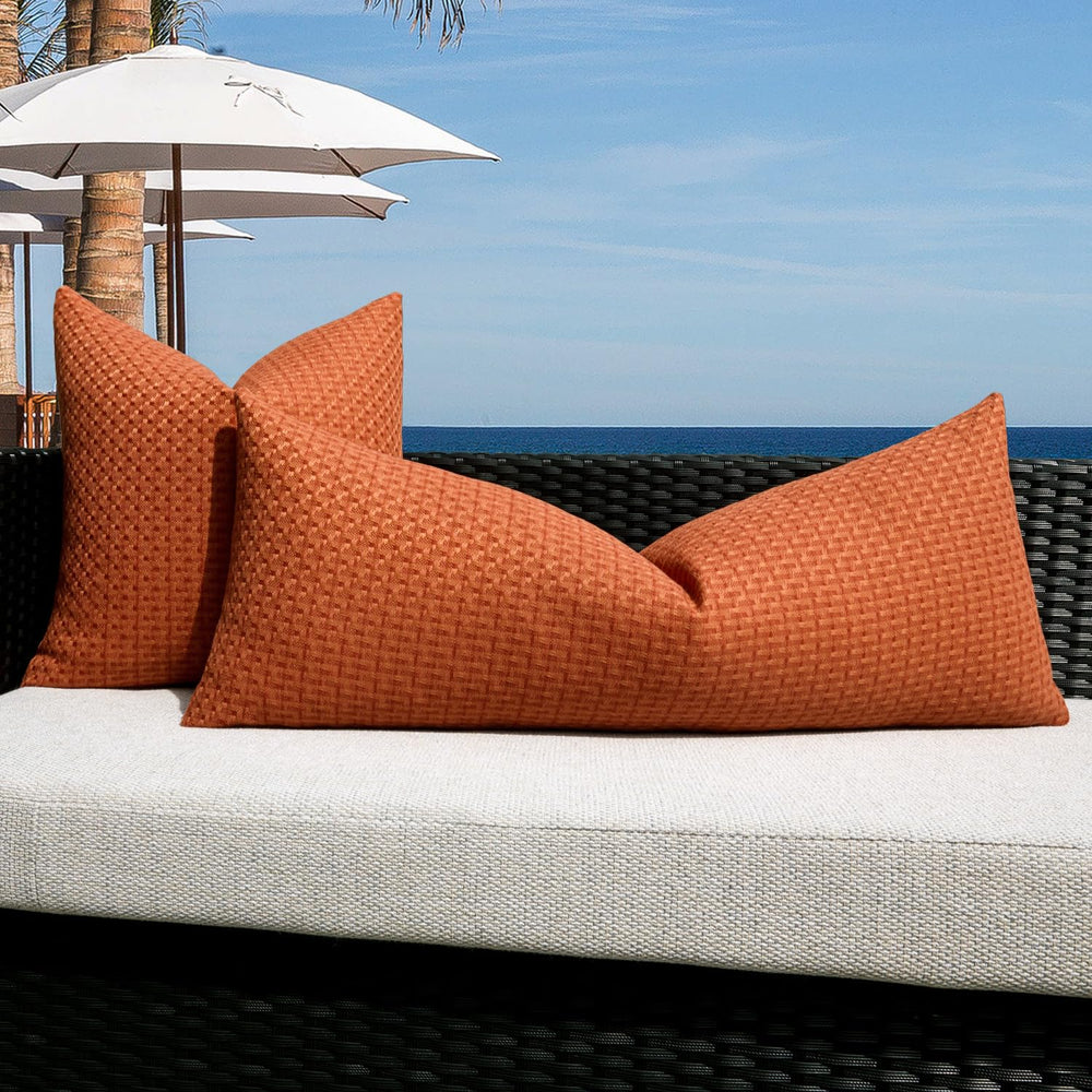 K KEVIN TEXTILE burnt orange pillow cover on a living room sofa