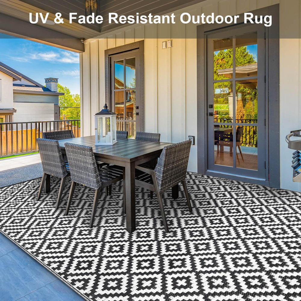 Kalafun Outdoor Patio Rug being cleaned with a hose