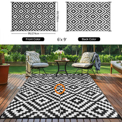 Kalafun Outdoor Patio Rug in a garden setting