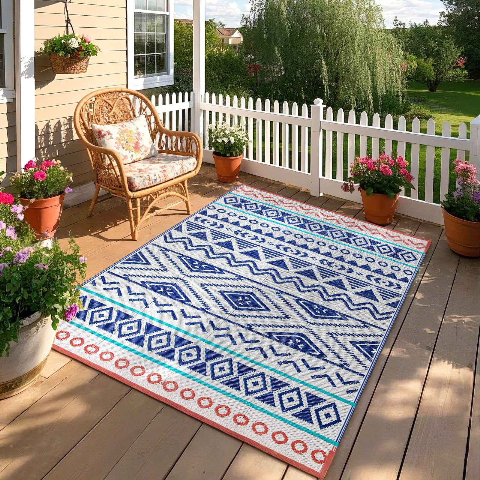 Kalafun Waterproof Reversible Patio Rug 8x10 ft, in an outdoor picnic setting