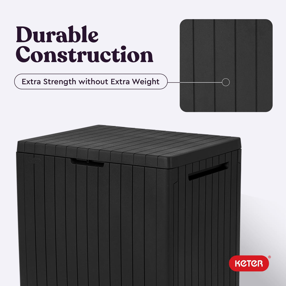 Keter City Storage Box with garden tools inside