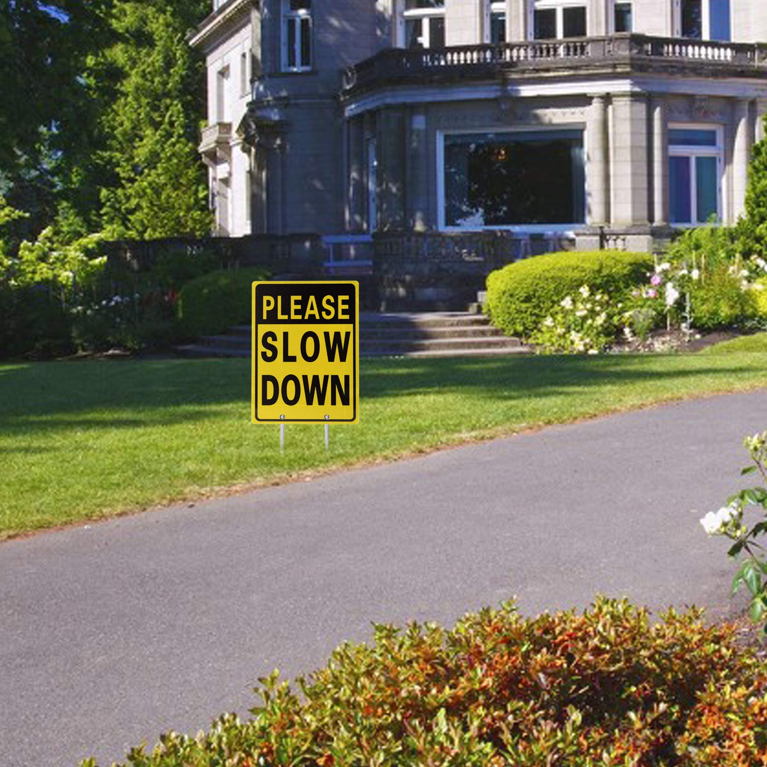 Kichwit Slow Down Sign displayed in a yard