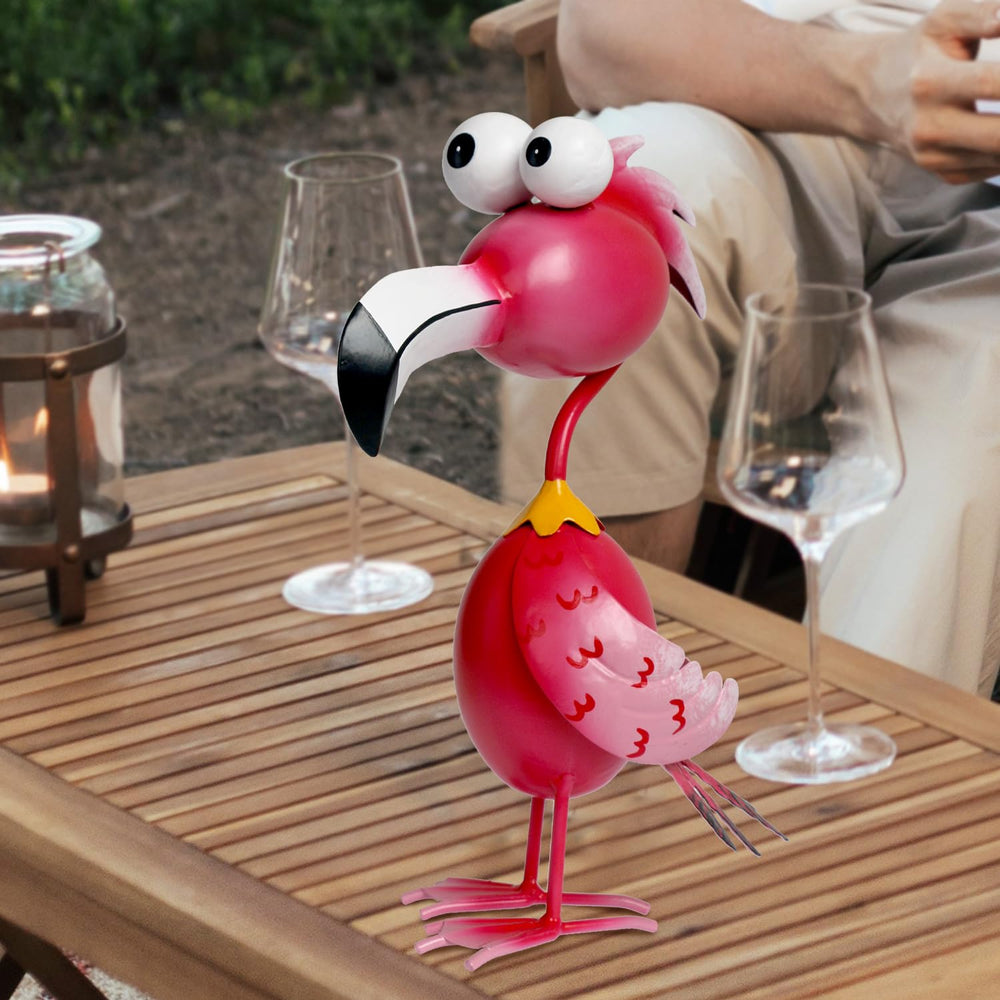 Kircust Flamingo Statue with flowers around it