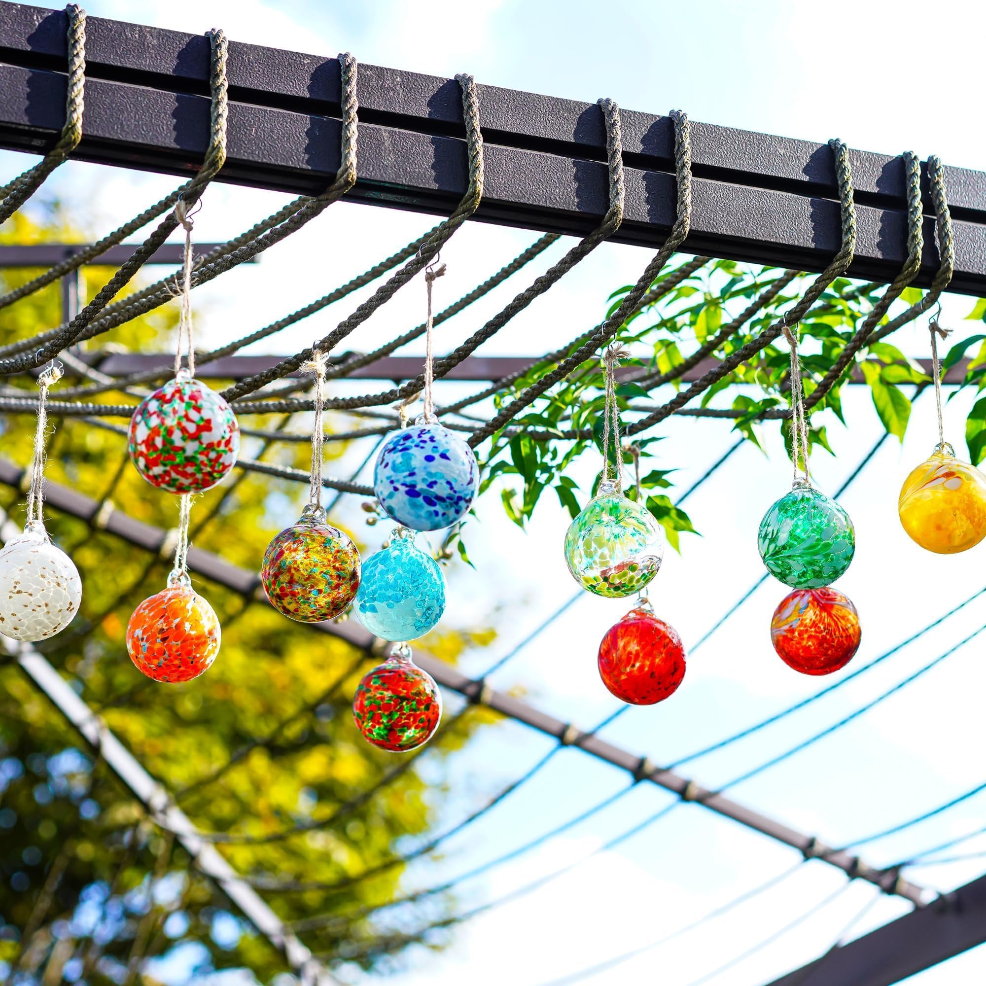 KRISININE glass gazing balls displayed in festive indoor decor