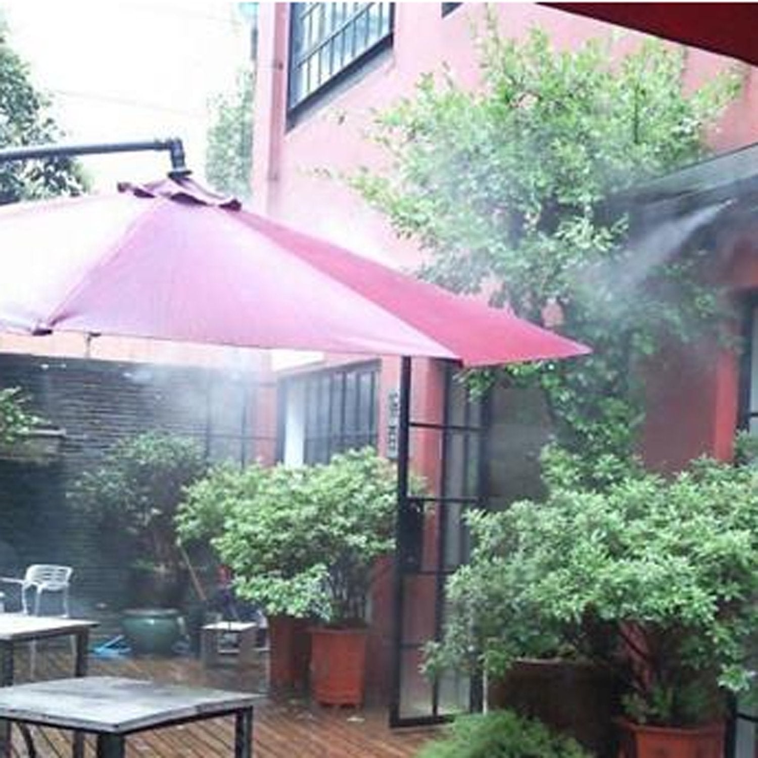 KUWAN Brass Misting Nozzle installed in an outdoor cooling system