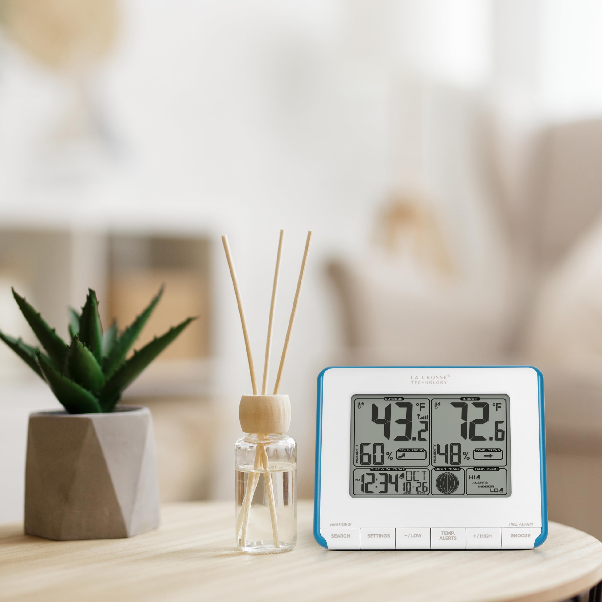 La Crosse Technology Weather Station with moon phase icons displayed