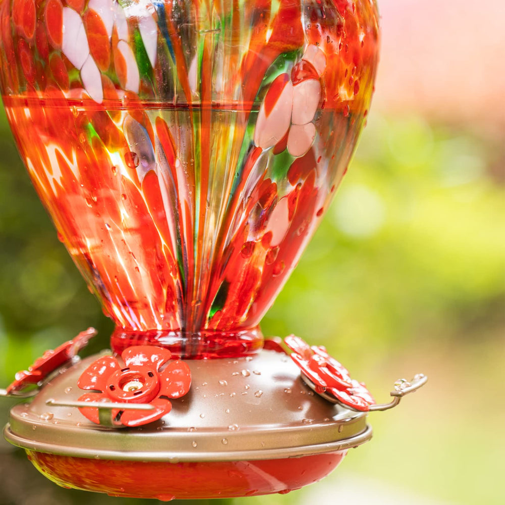 LaElvish Garden Hummingbird Feeder hanging in a garden
