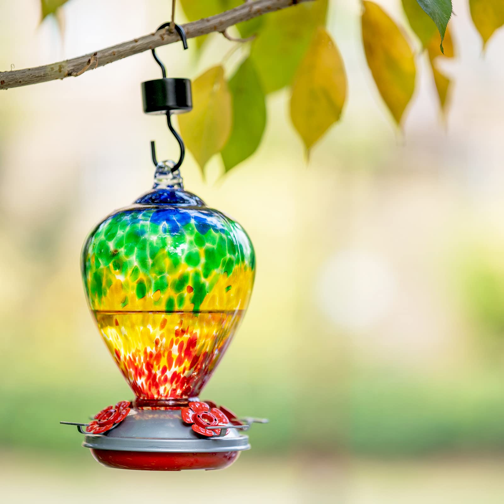 LaElvish Hummingbird Feeder displayed in a garden setting