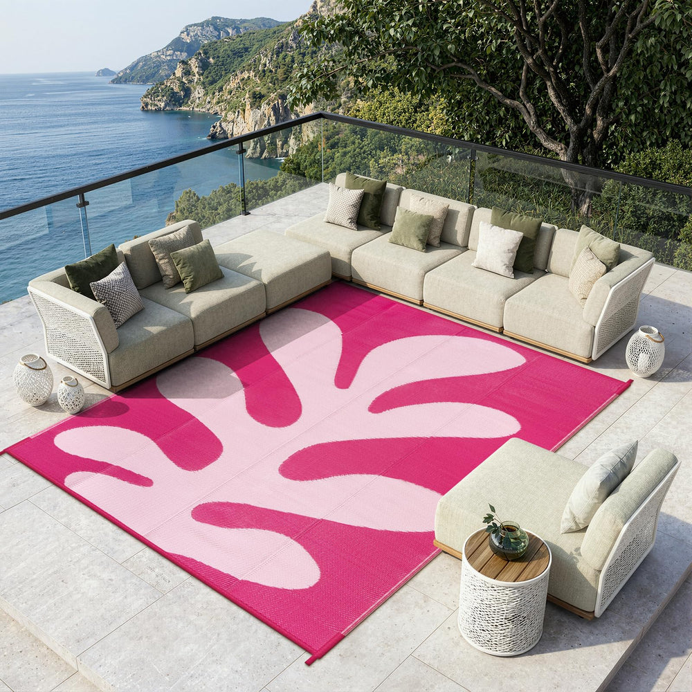 Lahome Outdoor Rug laid out on grass