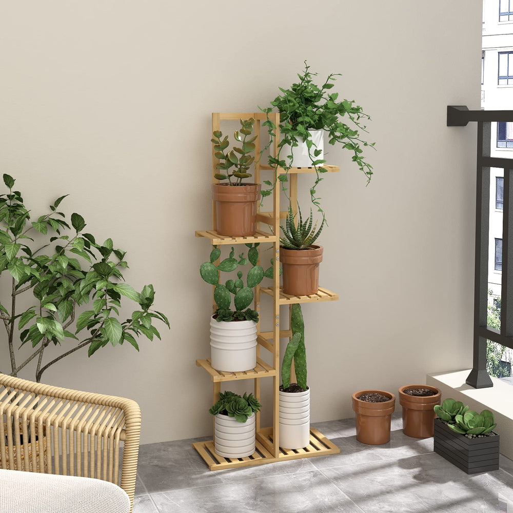 Laiensia Plant Stand displayed on a balcony with potted plants
