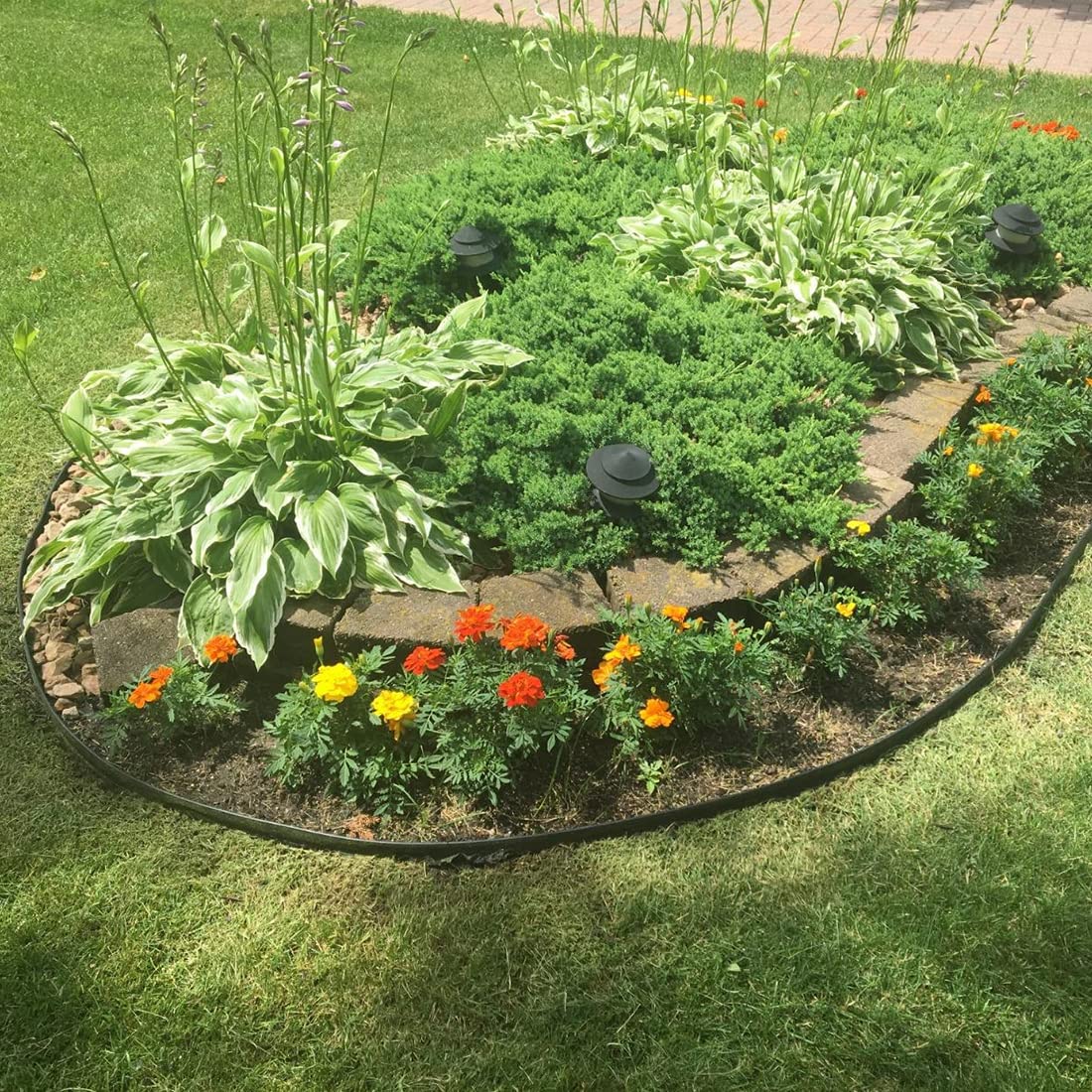 Landscape edging kit installed along a lawn path