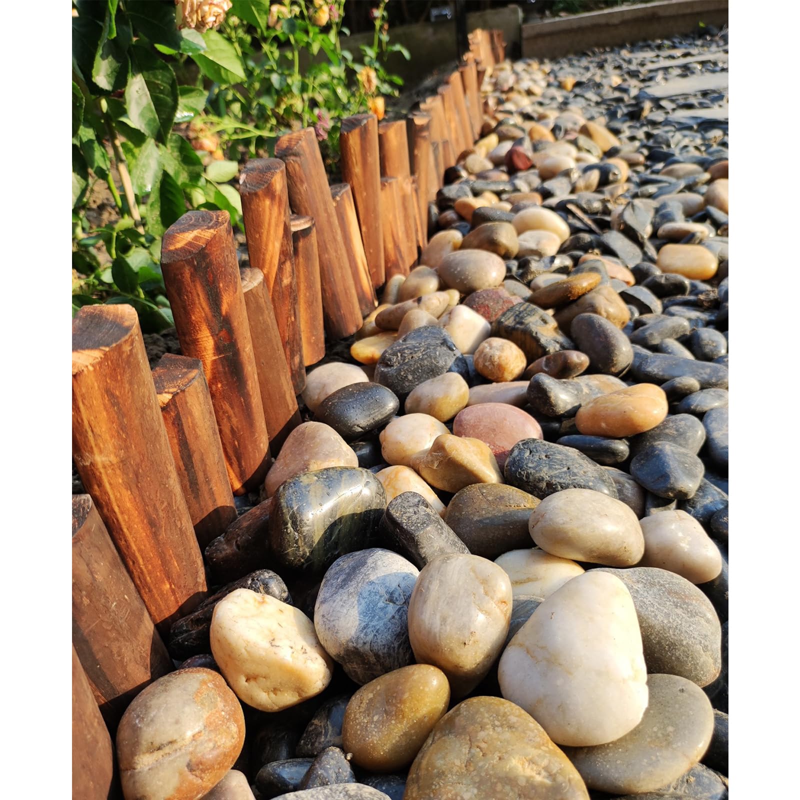 Landscaping with FANTIAN river pebbles in a garden