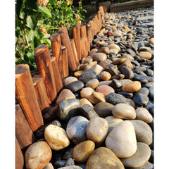 Landscaping with FANTIAN river pebbles in a garden