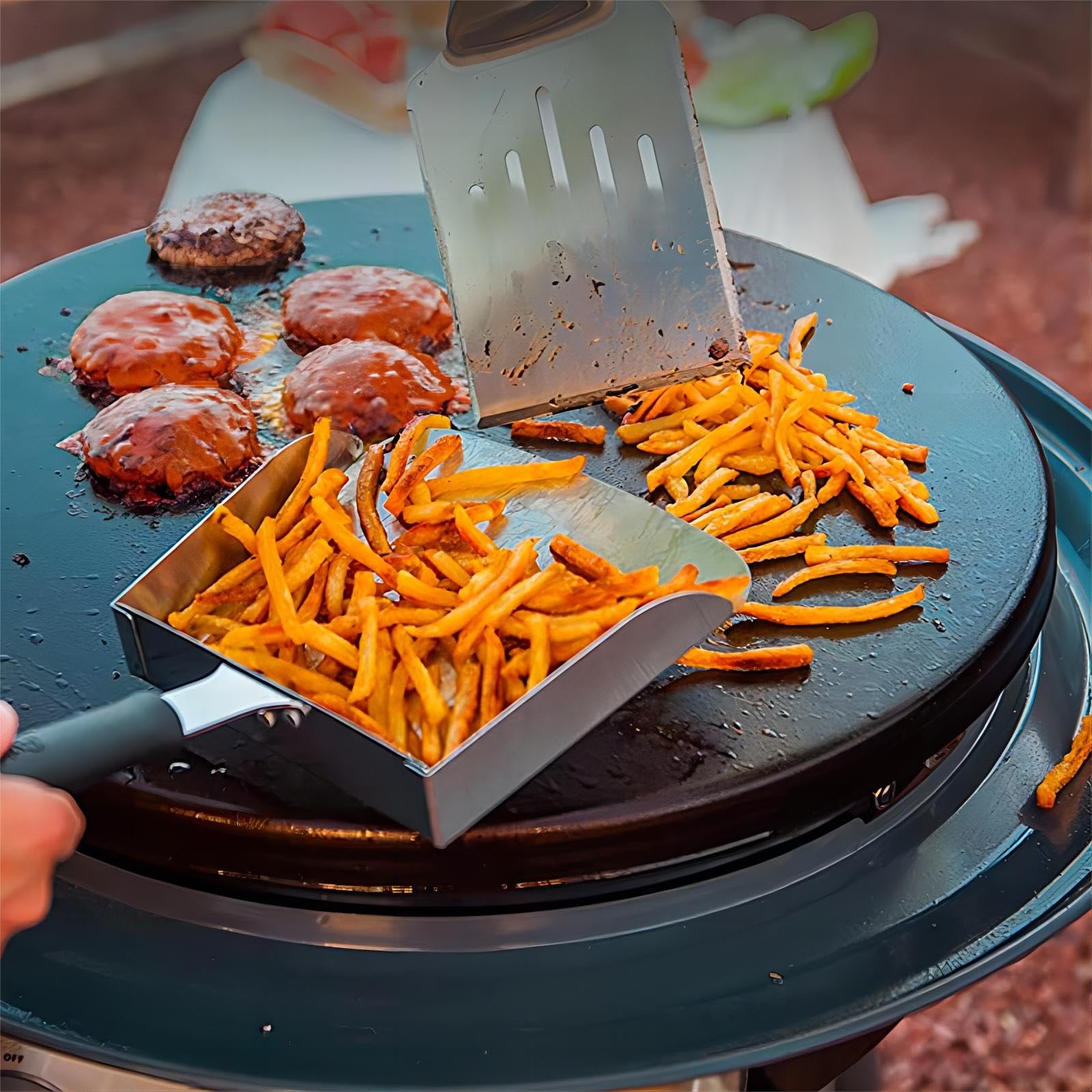 Large Griddle Scoop in use flipping burgers on a griddle