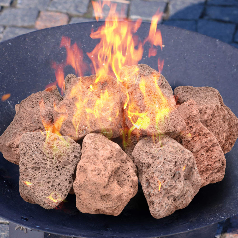 Lava rocks in a fire pit setting with flames
