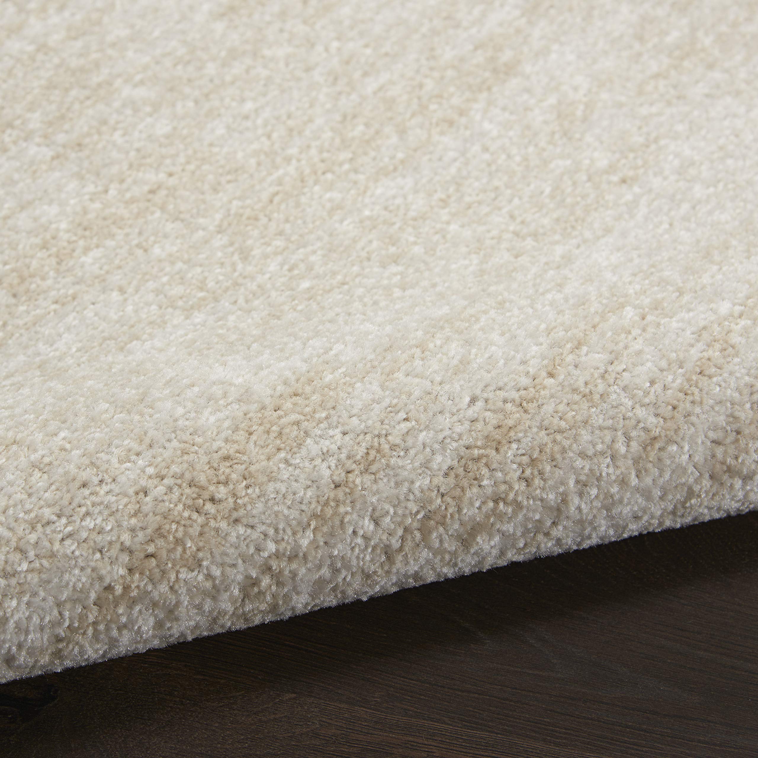 Layered rugs featuring Nourison Essentials rug