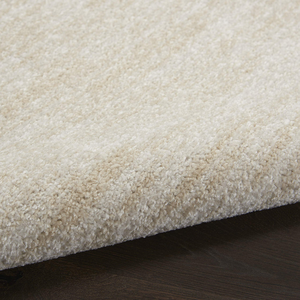 Layered rugs featuring Nourison Essentials rug