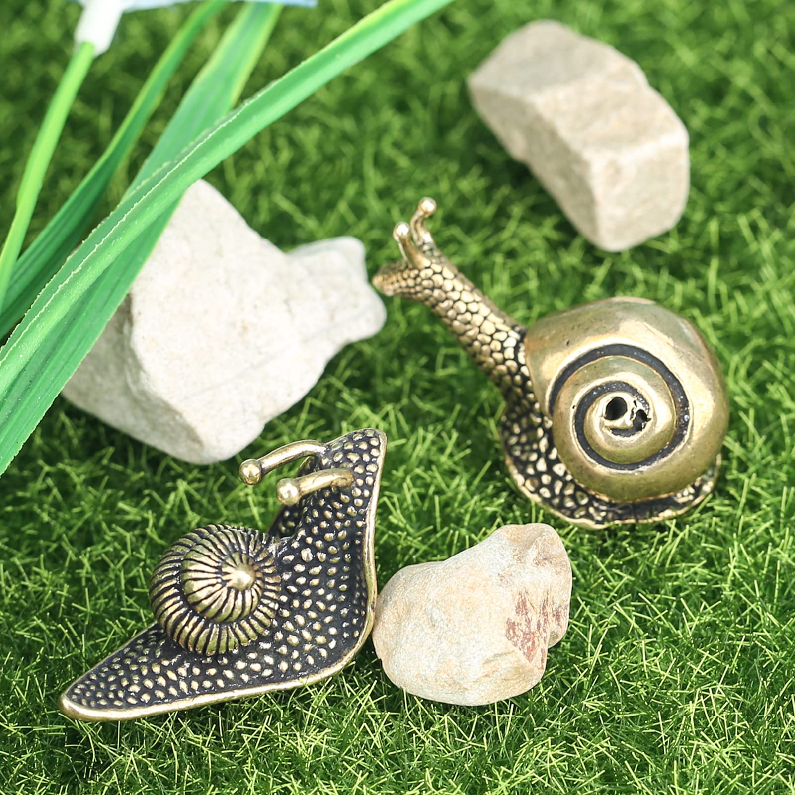 LCCCK Snail Statues on a bookshelf adding to decor.