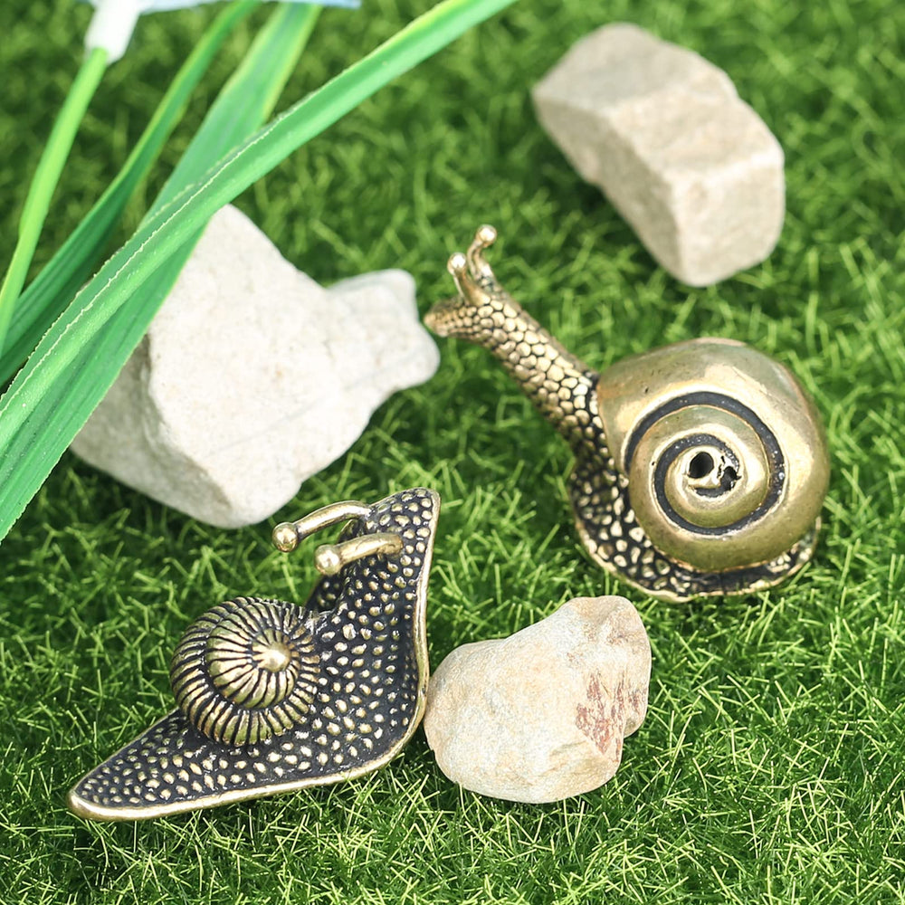 LCCCK Snail Statues on a bookshelf adding to decor.
