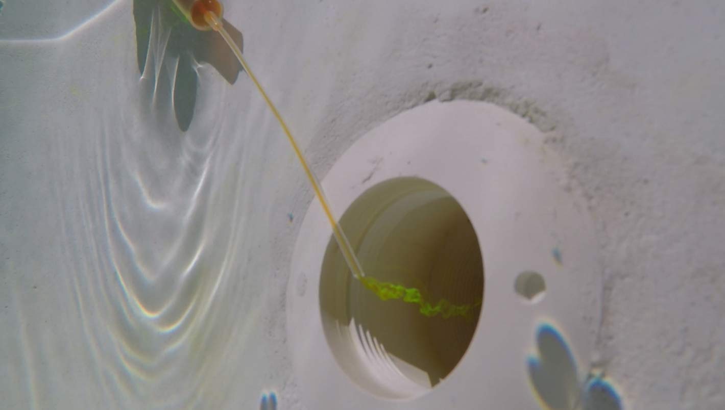 Leakmaster Pool Dye syringe close-up showing the 6 inch needle