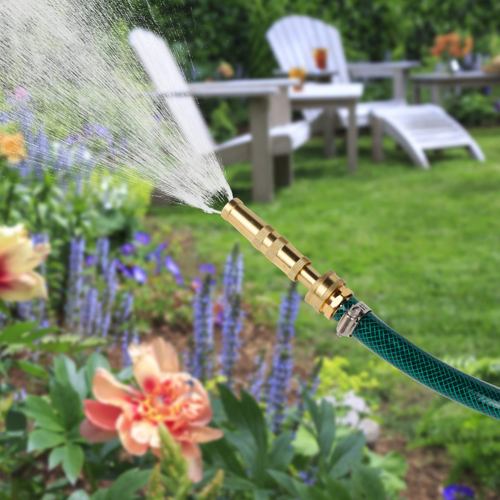 Lifestyle image of Biswing Brass Hose Nozzle in use watering garden