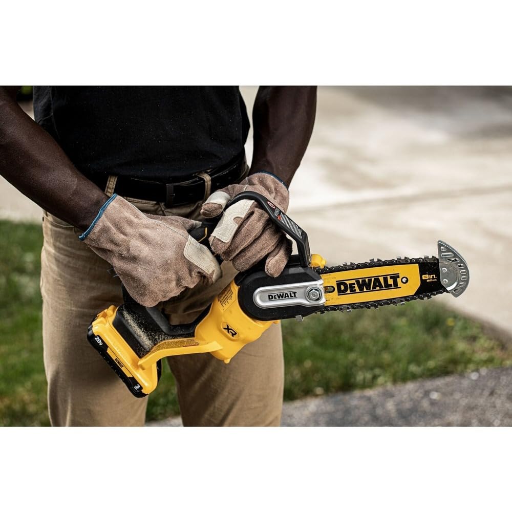 Lifestyle image of DEWALT Chainsaw DCCS623B in a garden setting