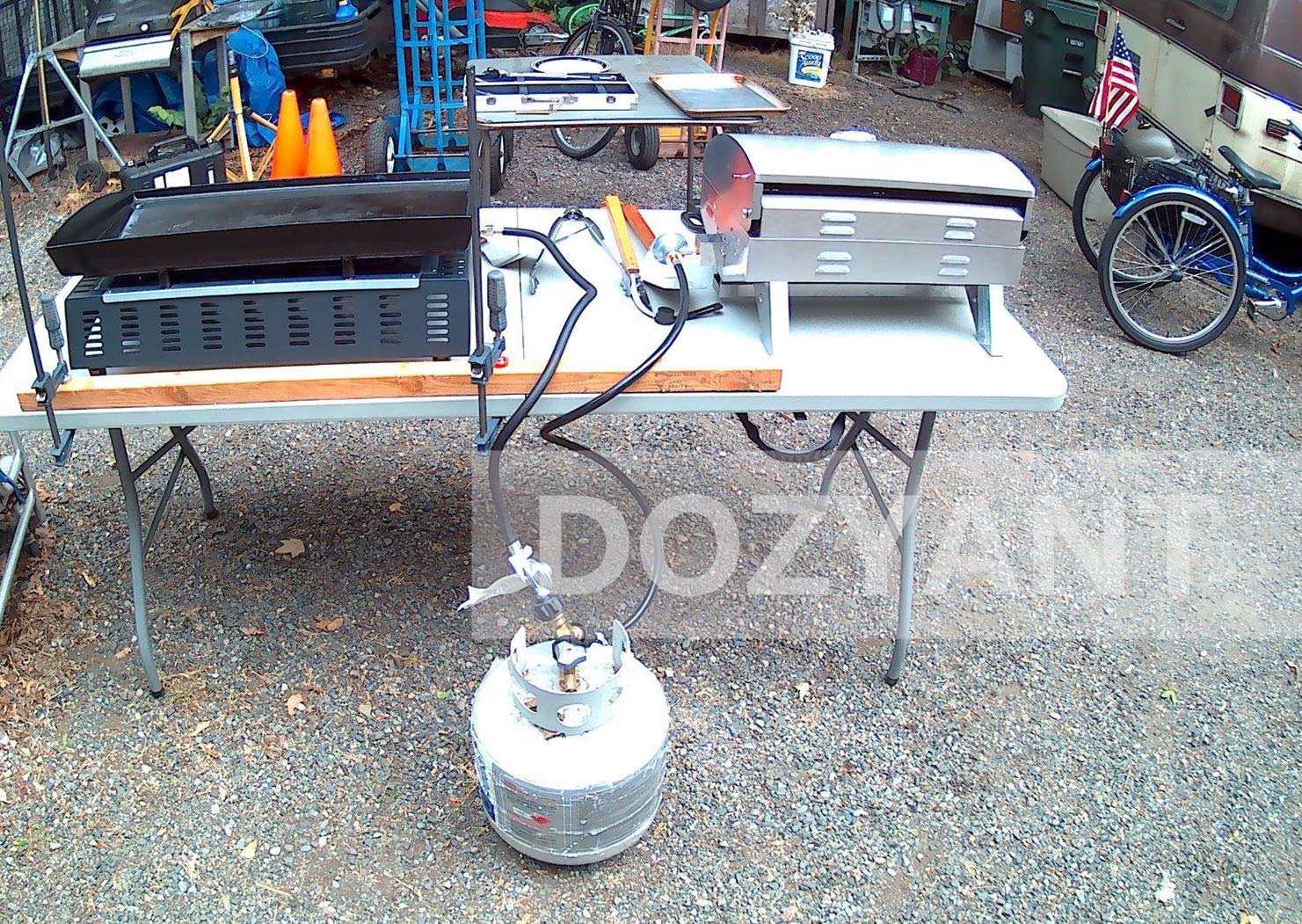 Lifestyle image of DOZYANT propane splitter in use with grill