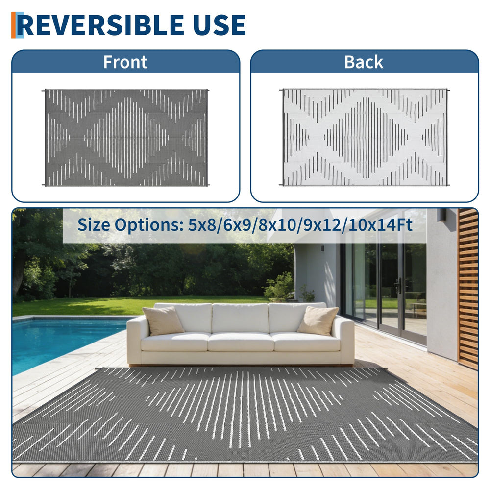 Lifestyle image of Garvee Outdoor Rug at a beach