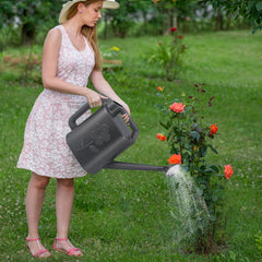 Lifestyle image of gegemaoyi watering can in a garden setting