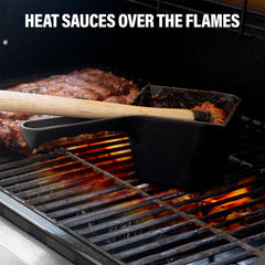 Lifestyle image of the basting pot and brush in use on grill