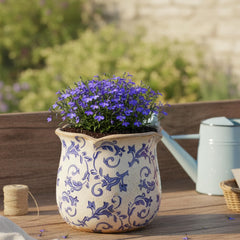 Lifestyle scene featuring Xiaan Jiaju Ceramic Planter with indoor plants