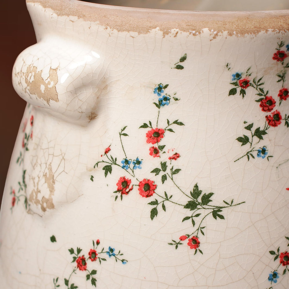 Lifestyle scene featuring Xiaan Jiaju planter on a shelf with flowers