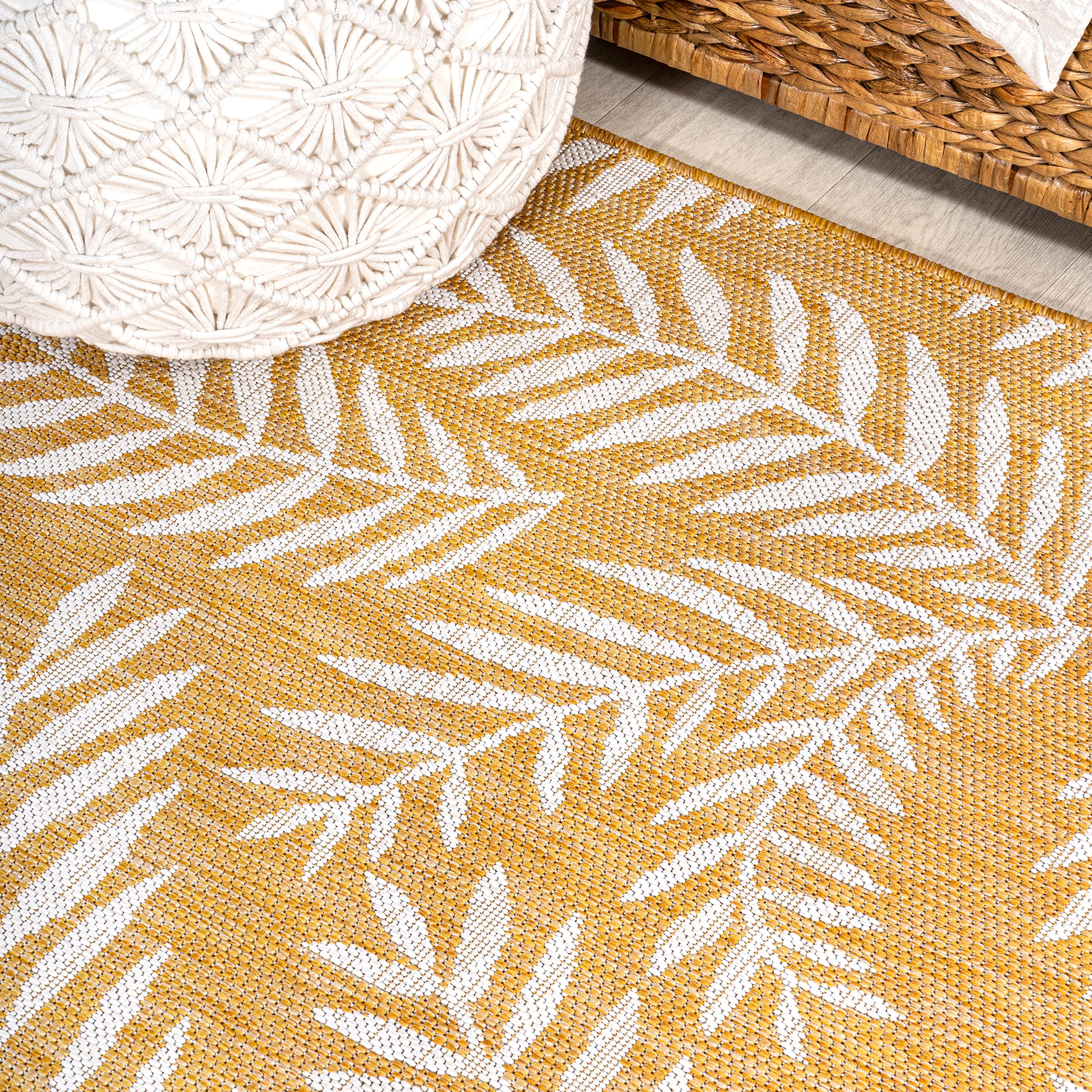 Lifestyle scene with JONATHAN Y Palm Frond Runner Rug on a patio