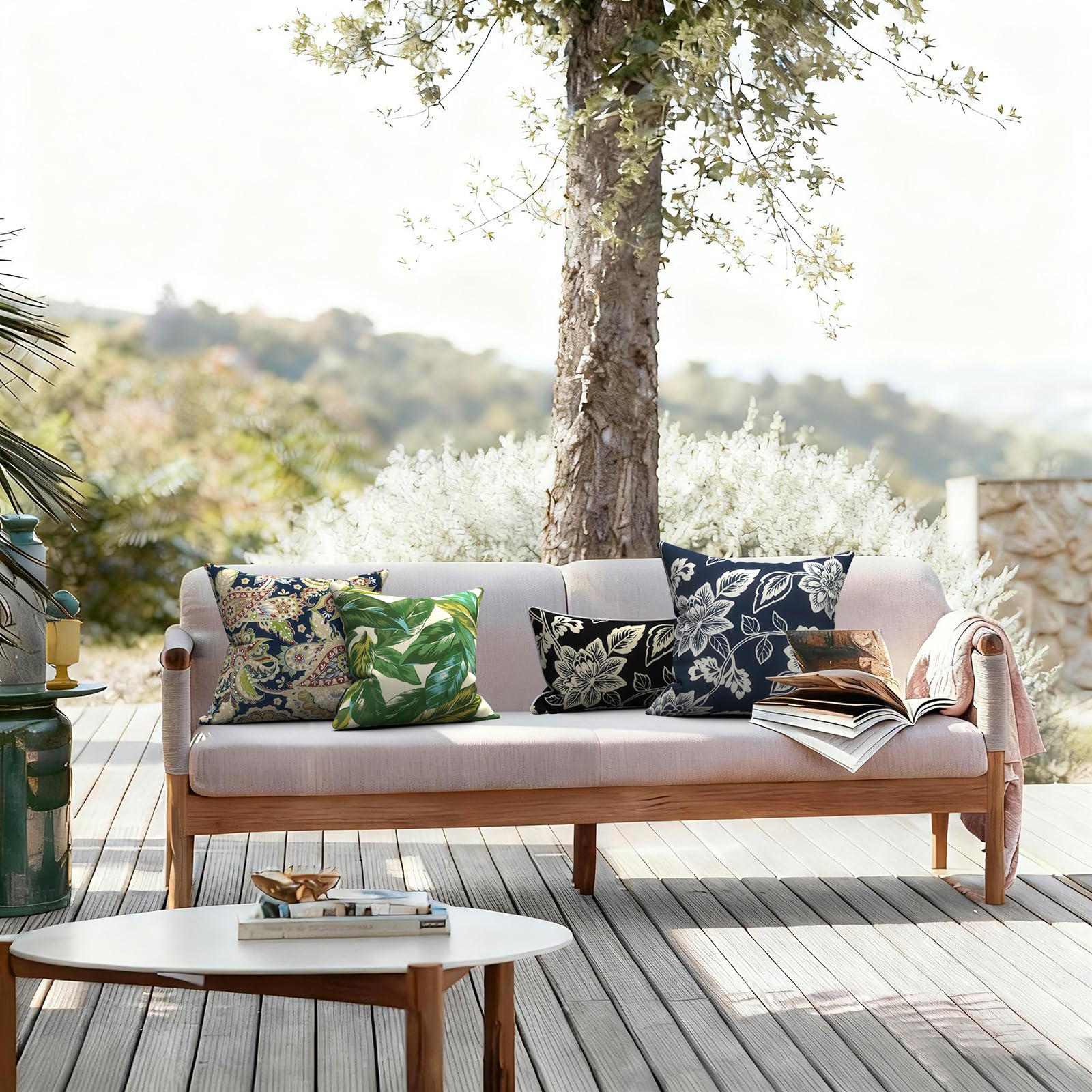 Lifestyle scene with LVTXIII outdoor pillow covers in a garden setting